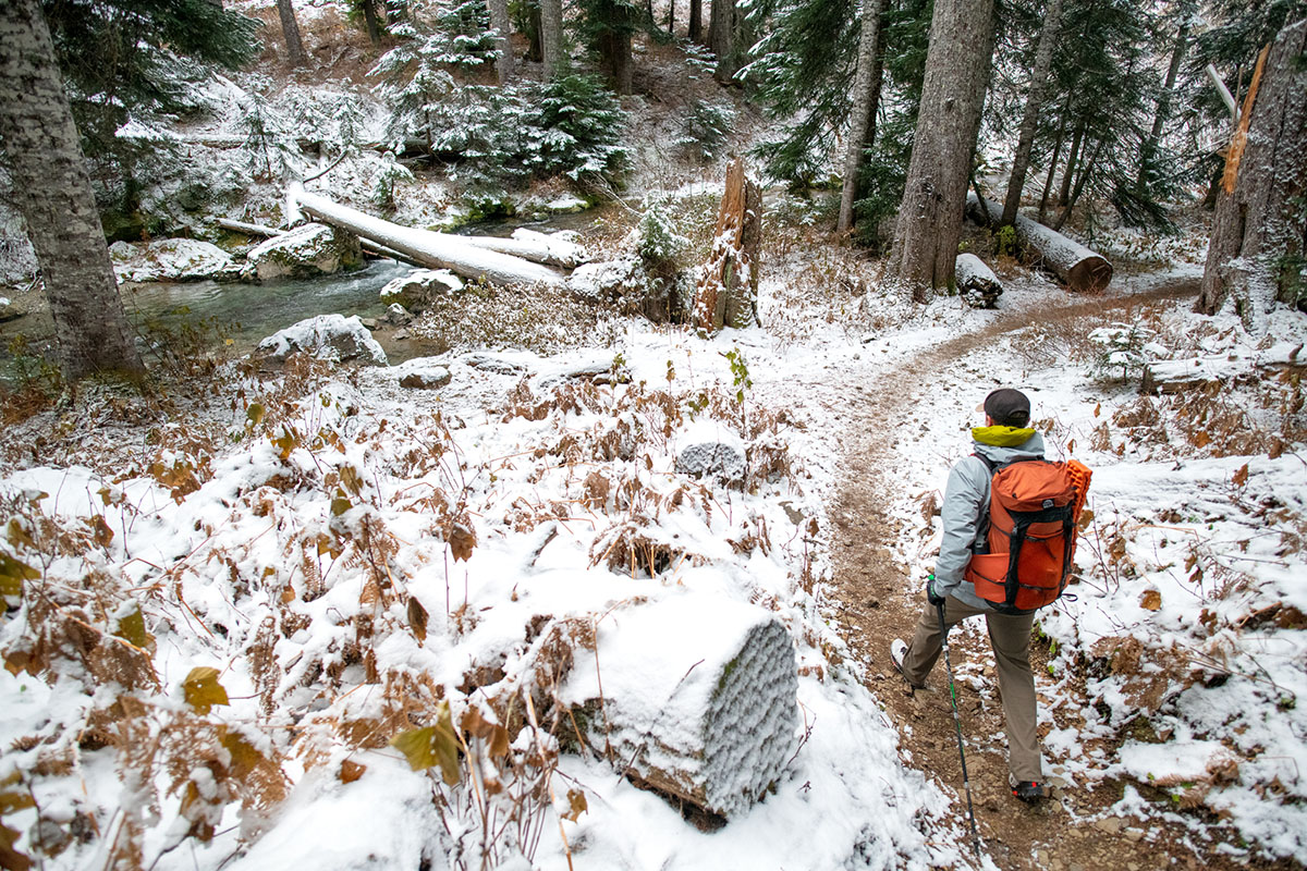 Arc'teryx Beta LT hardshell jacket (wide shot on trail)