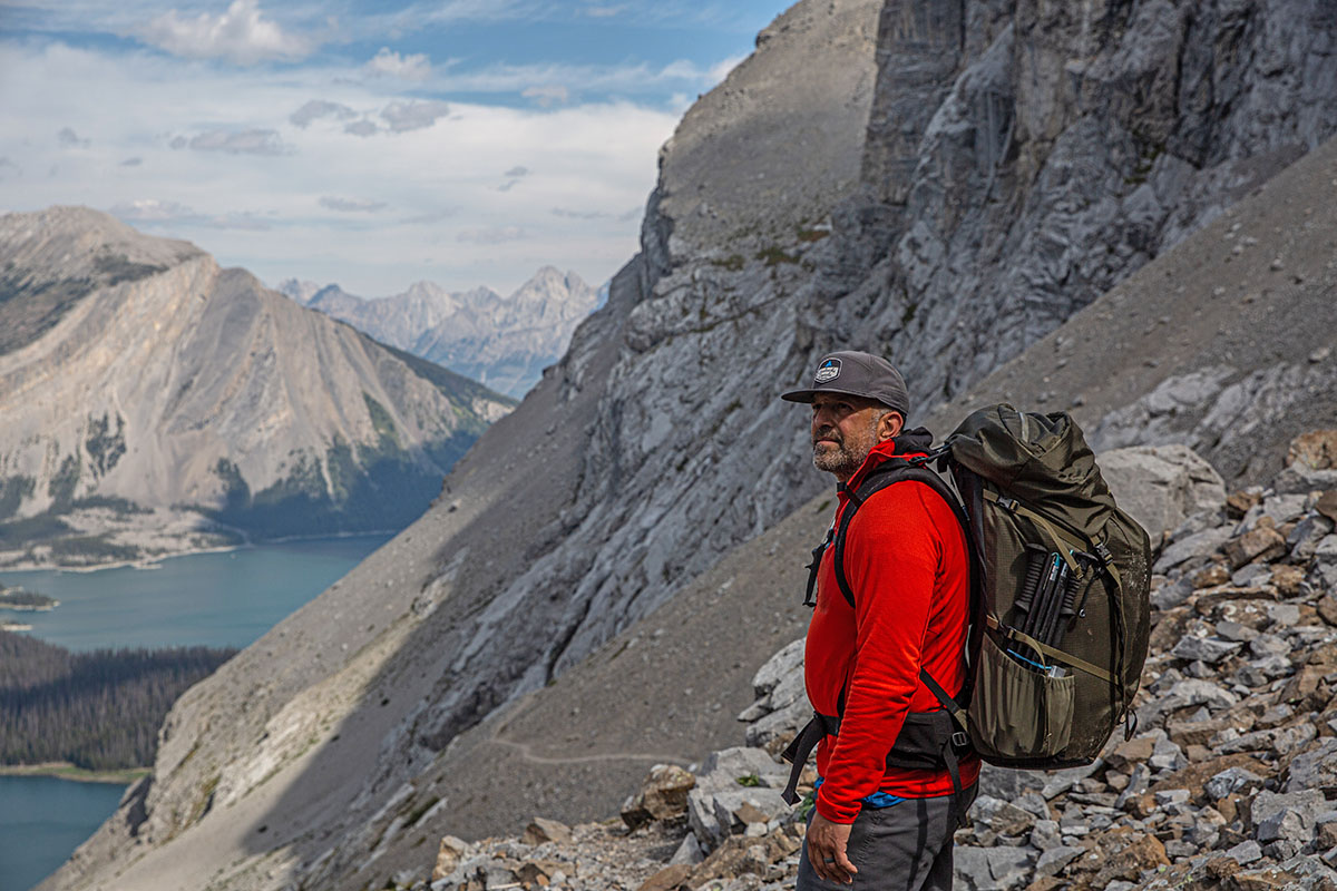 ​​Arc'teryx Bora 75 backpacking backpack (standing above lake in mountains)