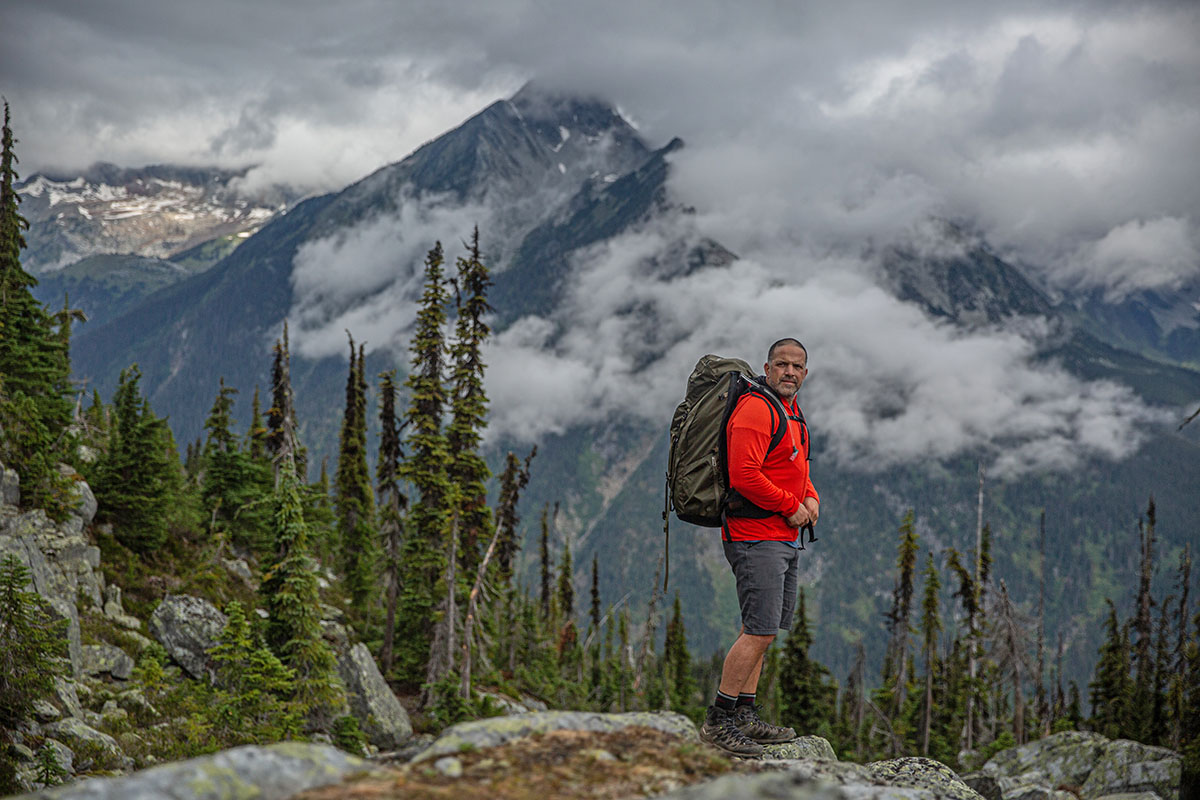 ​​Arc'teryx Bora 75 backpacking backpack (standing in moody mountains)