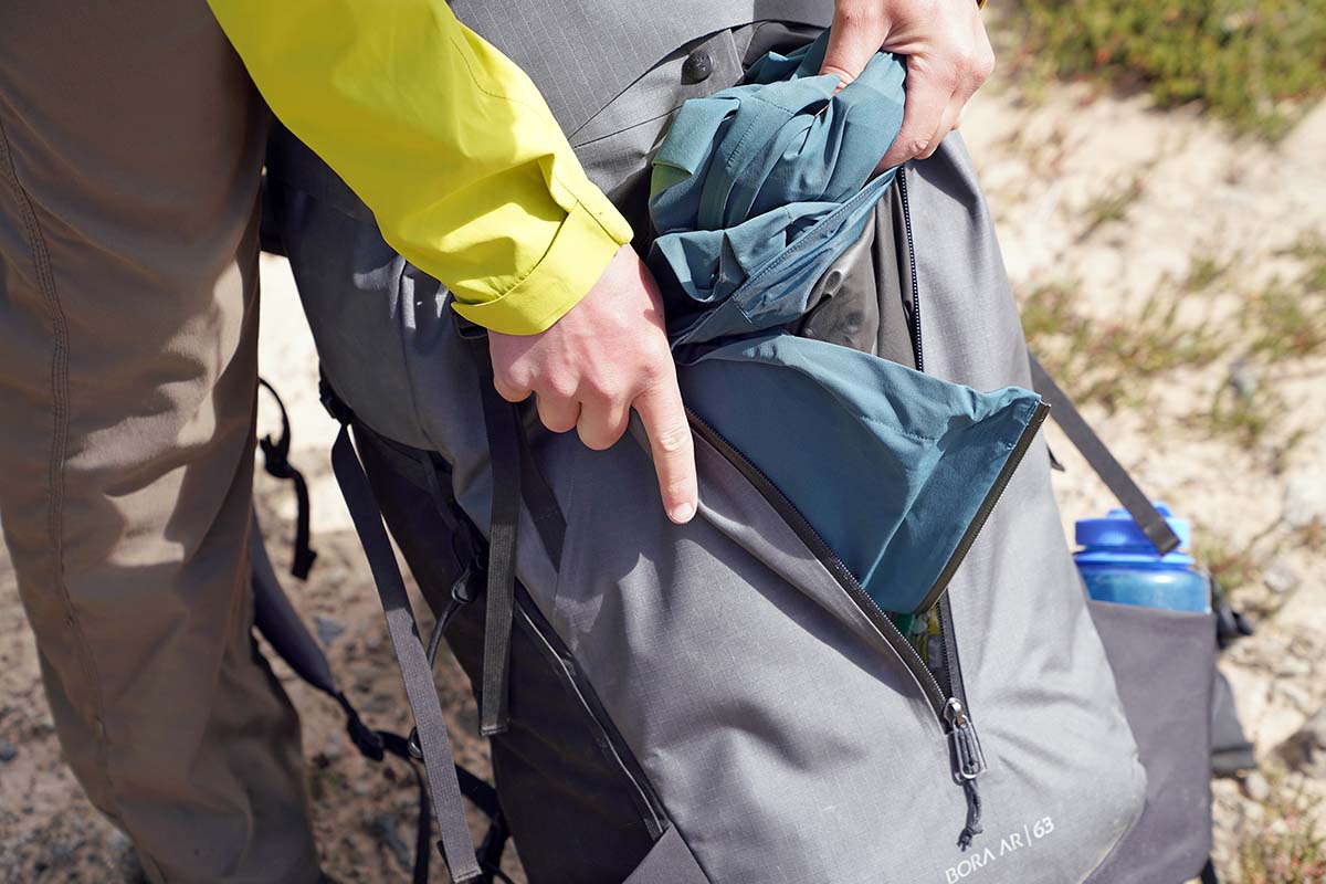 Arc'teryx Bora AR 63 backpacking pack (removing jacket from front kangaroo zip pocket)