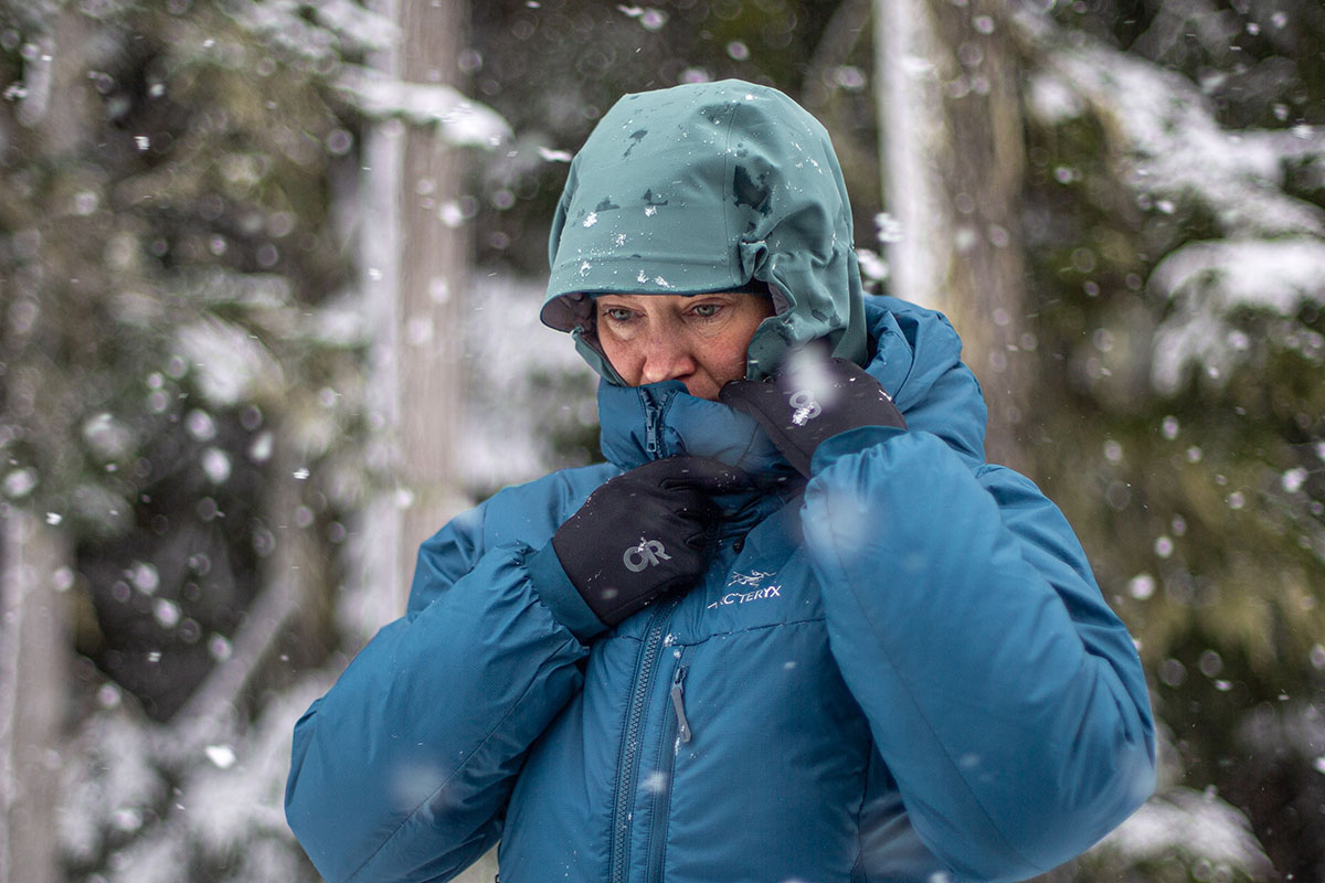 ​​Arc'teryx Nuclei SV Parka (zipping up in snow)