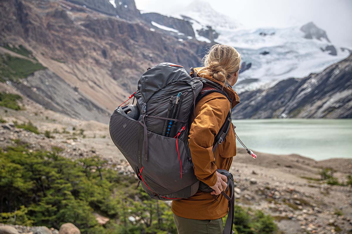 Fjallraven Keb Eco-Shell Jacket (wearing backpack in front of glacier)