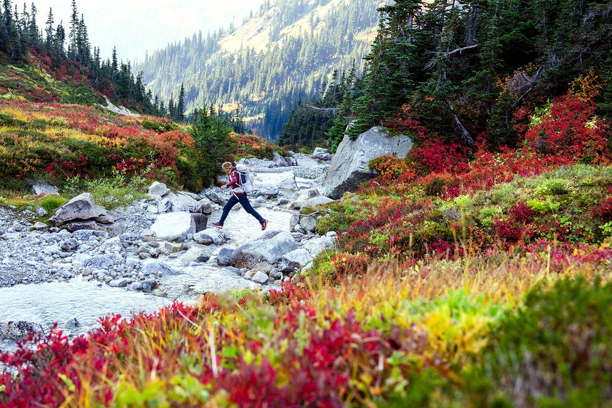 Granite Gear Crown3 backpacking pack (jumping across stream)