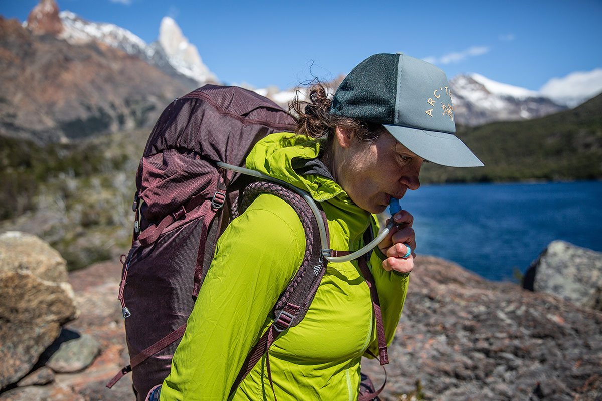 Gregory Deva 70 backpack (drinking from water bladder)