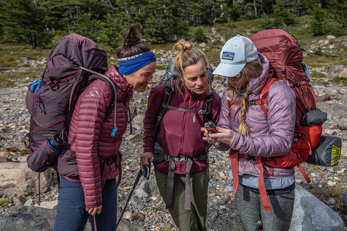 Gregory Deva 70 backpack (standing in group looking at GPS)