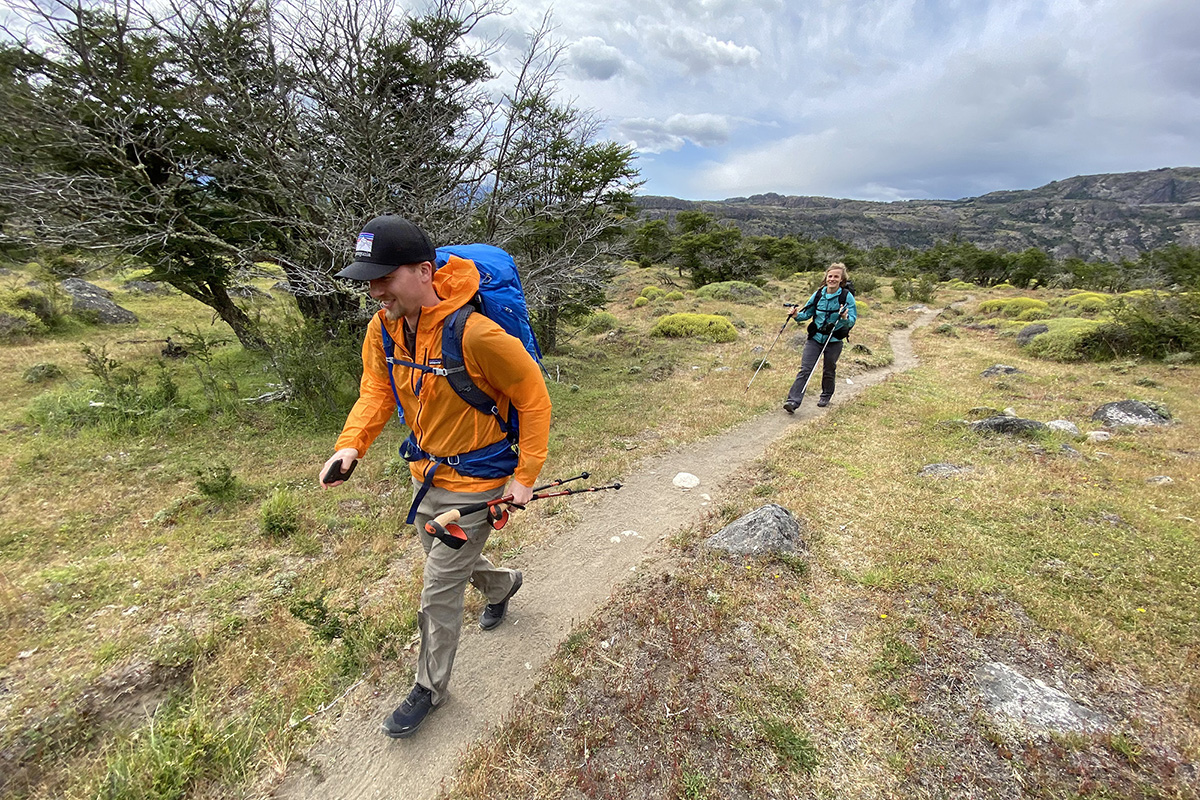 Gregory Optic 58 backpacking pack (hiking on trail smiling)