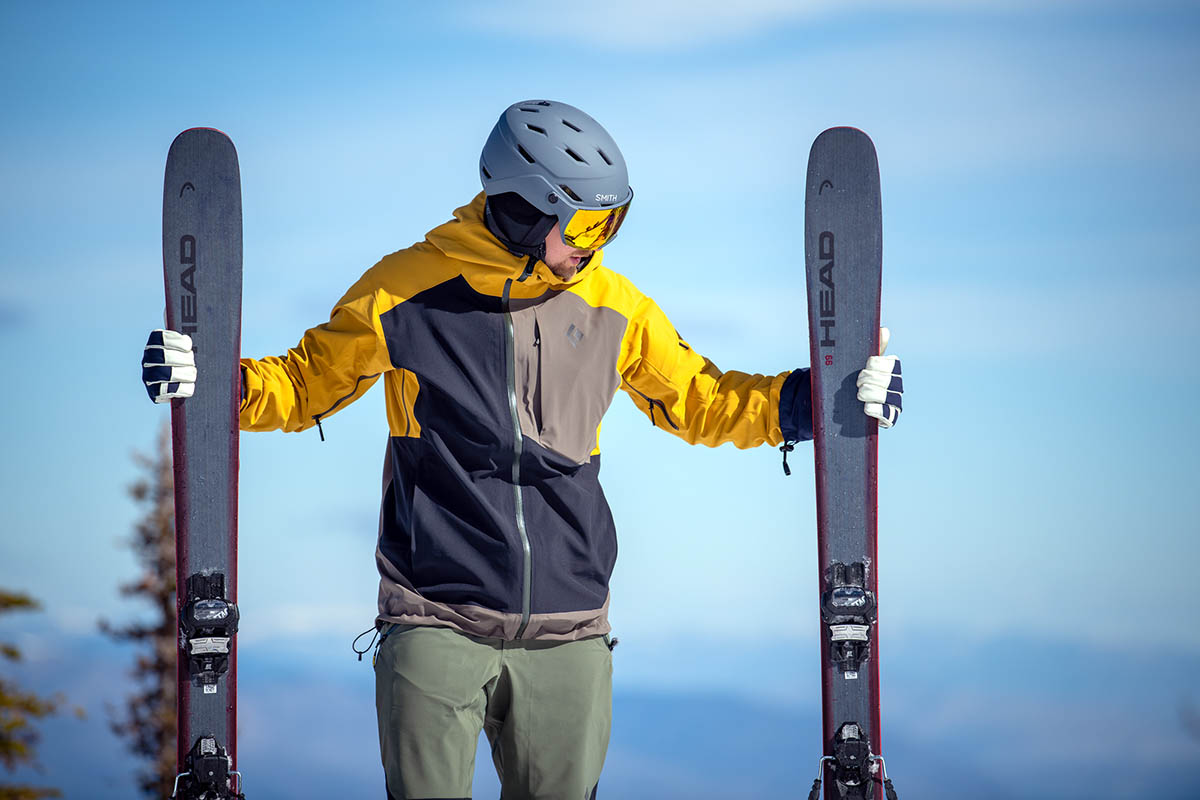 Head Kore 99 all-mountain ski (standing next to skis)