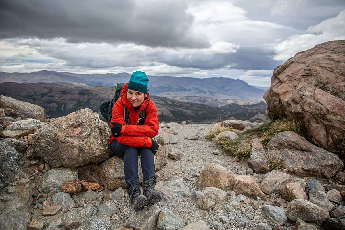 Lowa Renegade GTX Mid hiking boot (sitting on rock)