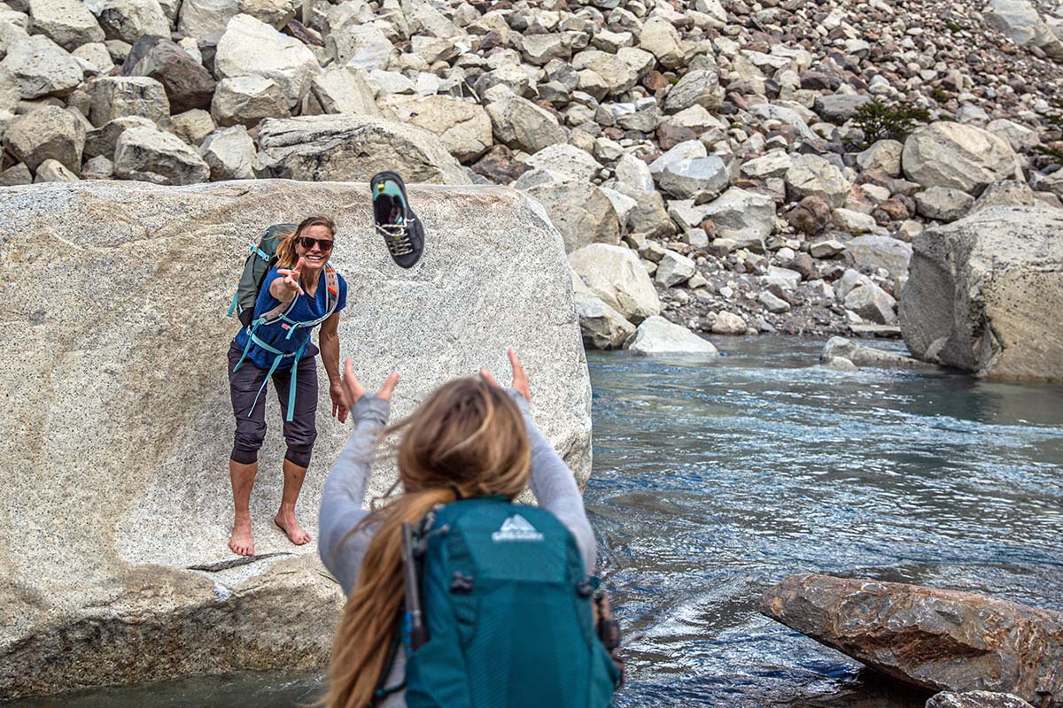 Throwing Merrell MQM 3 GTX hiking shoe over water