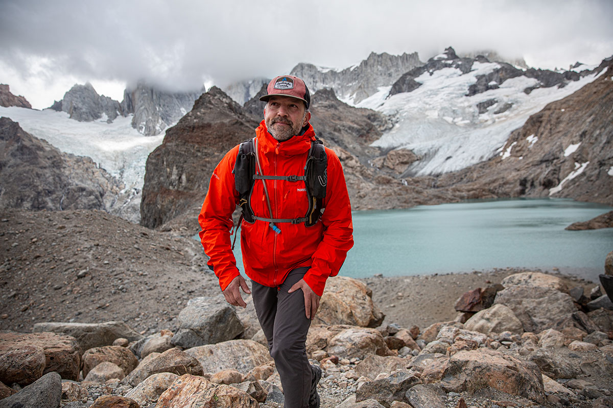 Norrøna Trollveggen Gore-Tex Pro Light Jacket (walking uphill above lake)