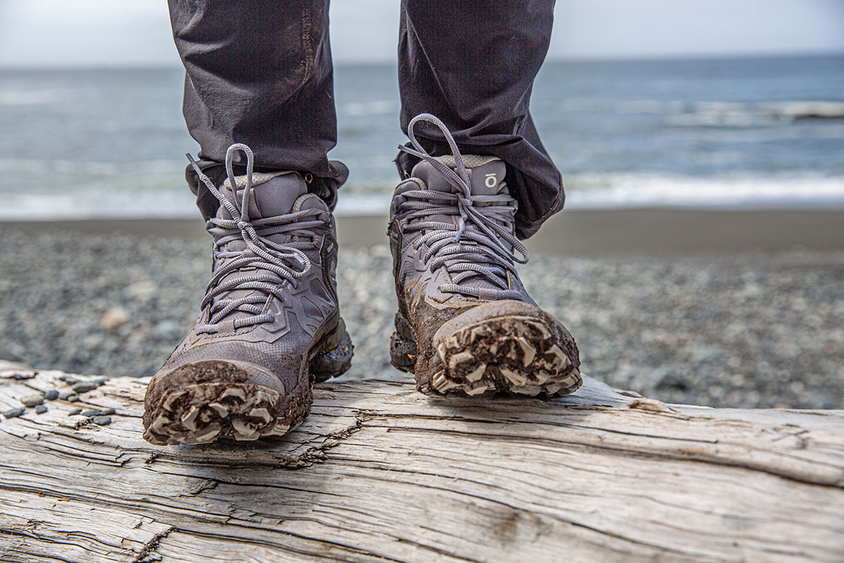 ​​Oboz Katabatic Mid Waterproof hiking boot (standing on log on beach)