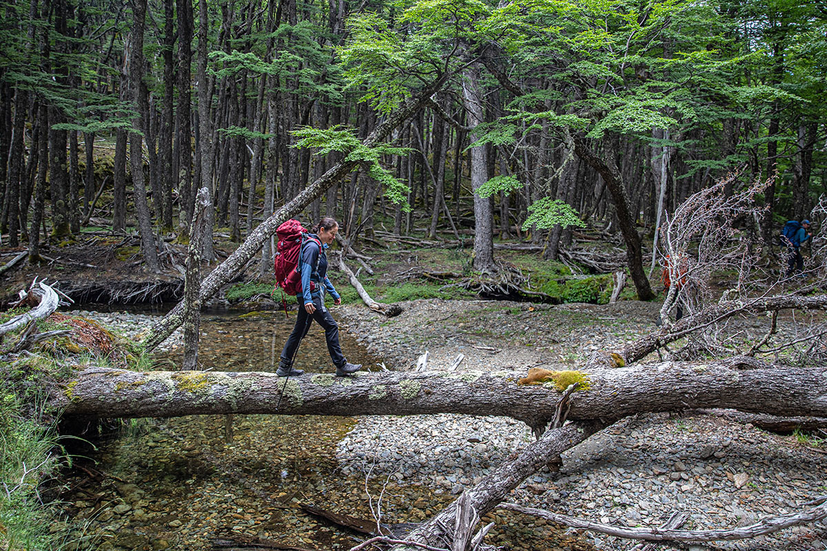 Osprey Ariel 65 backpacking pack (crossing water on log)