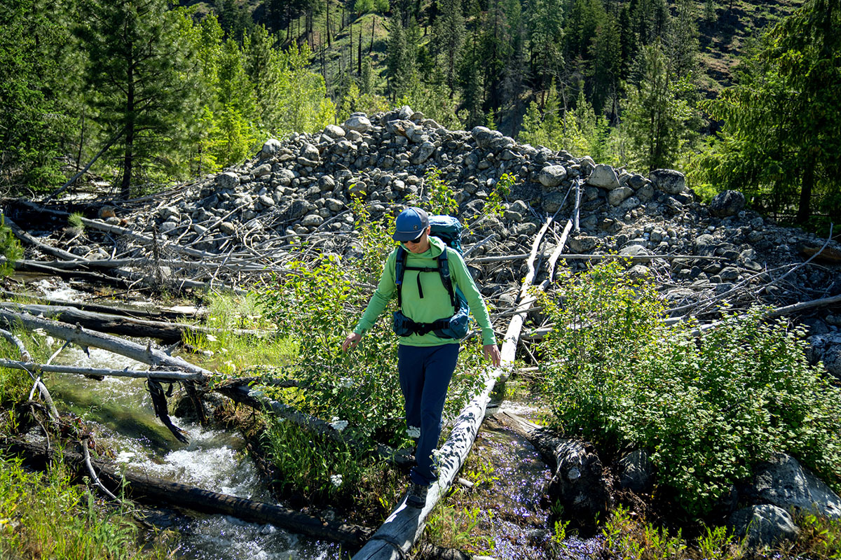 Osprey Atmos AG 65 backpacking pack (balancing on log)