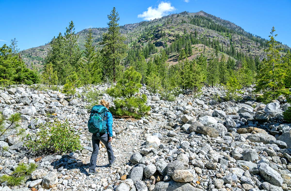 Hiking in riverbed (Osprey Eja 58 backpack)