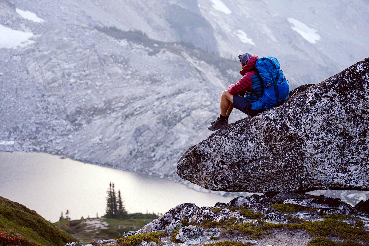 Osprey Exos 58 backpacking backpack (resting on rock ledge)