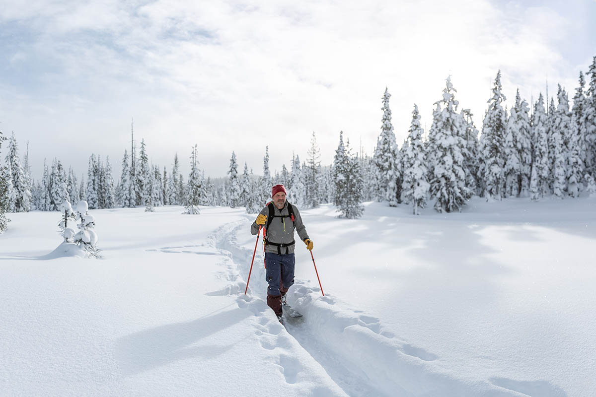 ​​Outdoor Research Kulshan Storm Bibs (skinning in snowy forest)