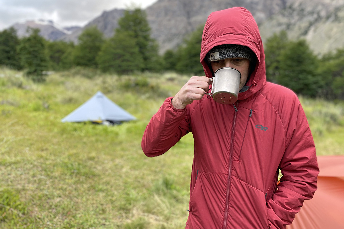 Outdoor Research Refuge Hooded synthetic jacket (drinking coffee in camp)