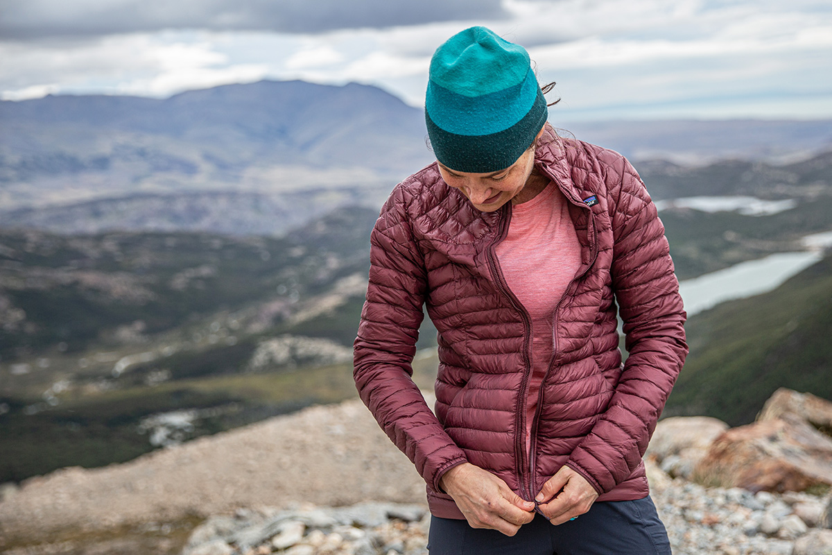 Patagonia AlpLight Down Jacket (zipping up while hiking in Patagonia)