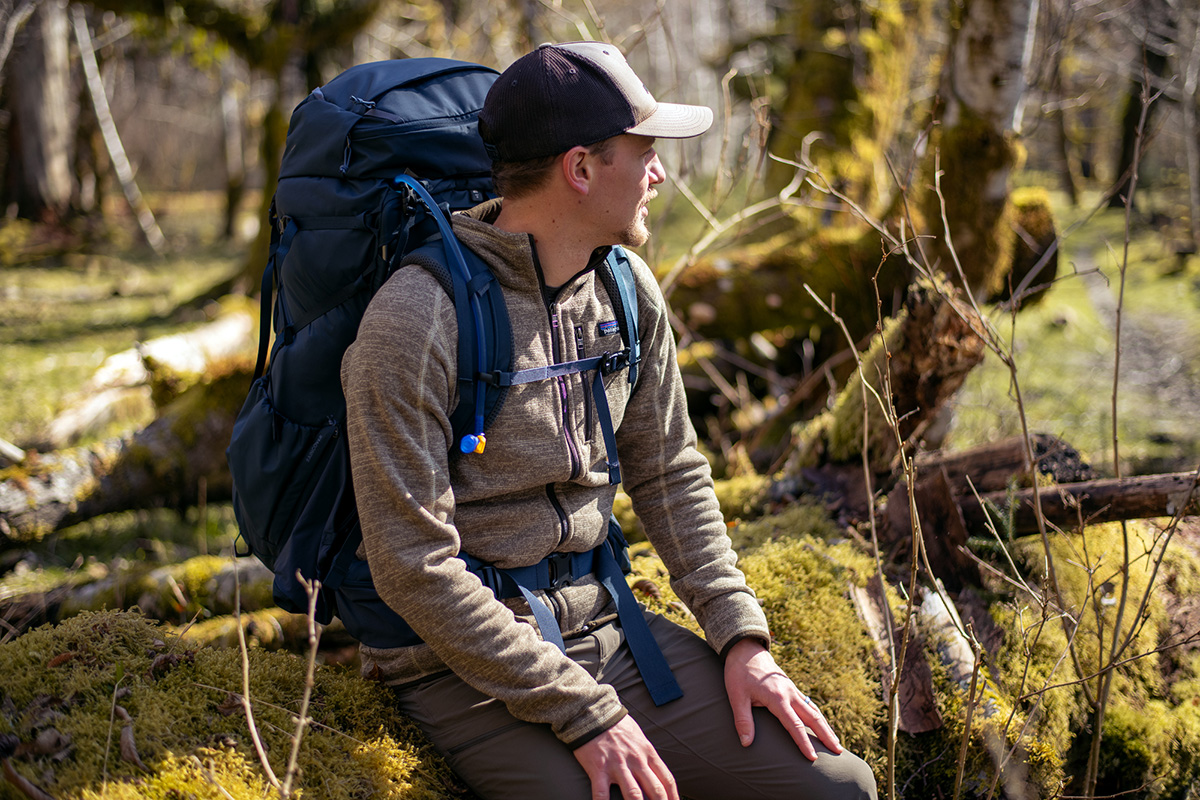 Patagonia Better Sweater Fleece Jacket (sitting on log in forest)