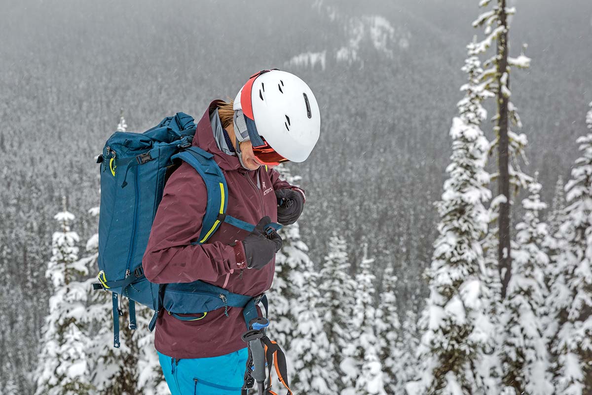 Adjusting sternum strap while backcountry skiing (Patagonia Descensionist 40L ski pack)