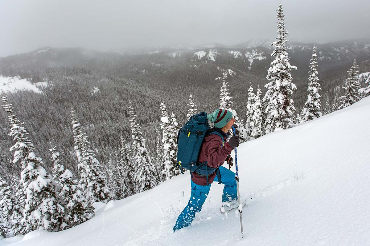 Breaking trail while skinning through fresh snow (wearing Patagonia Descensionist 40L ski pack)