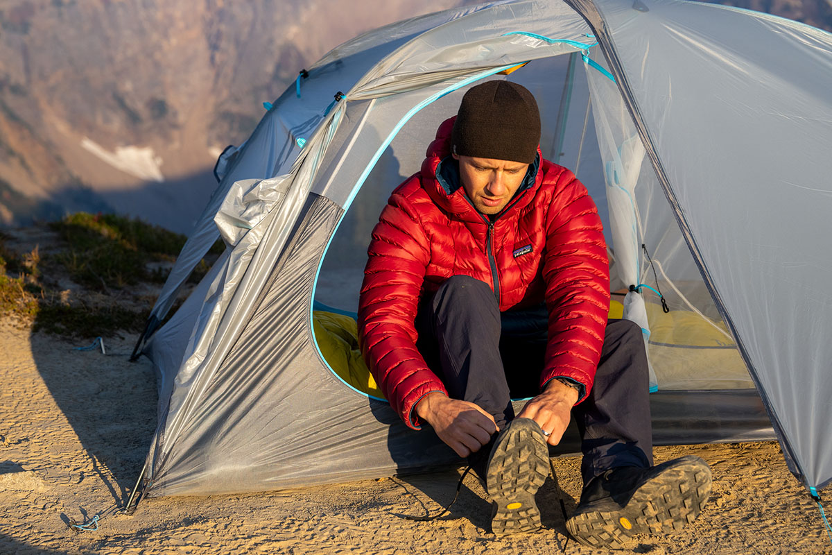 Patagonia Down Sweater Hoody (tying shoes in tent)