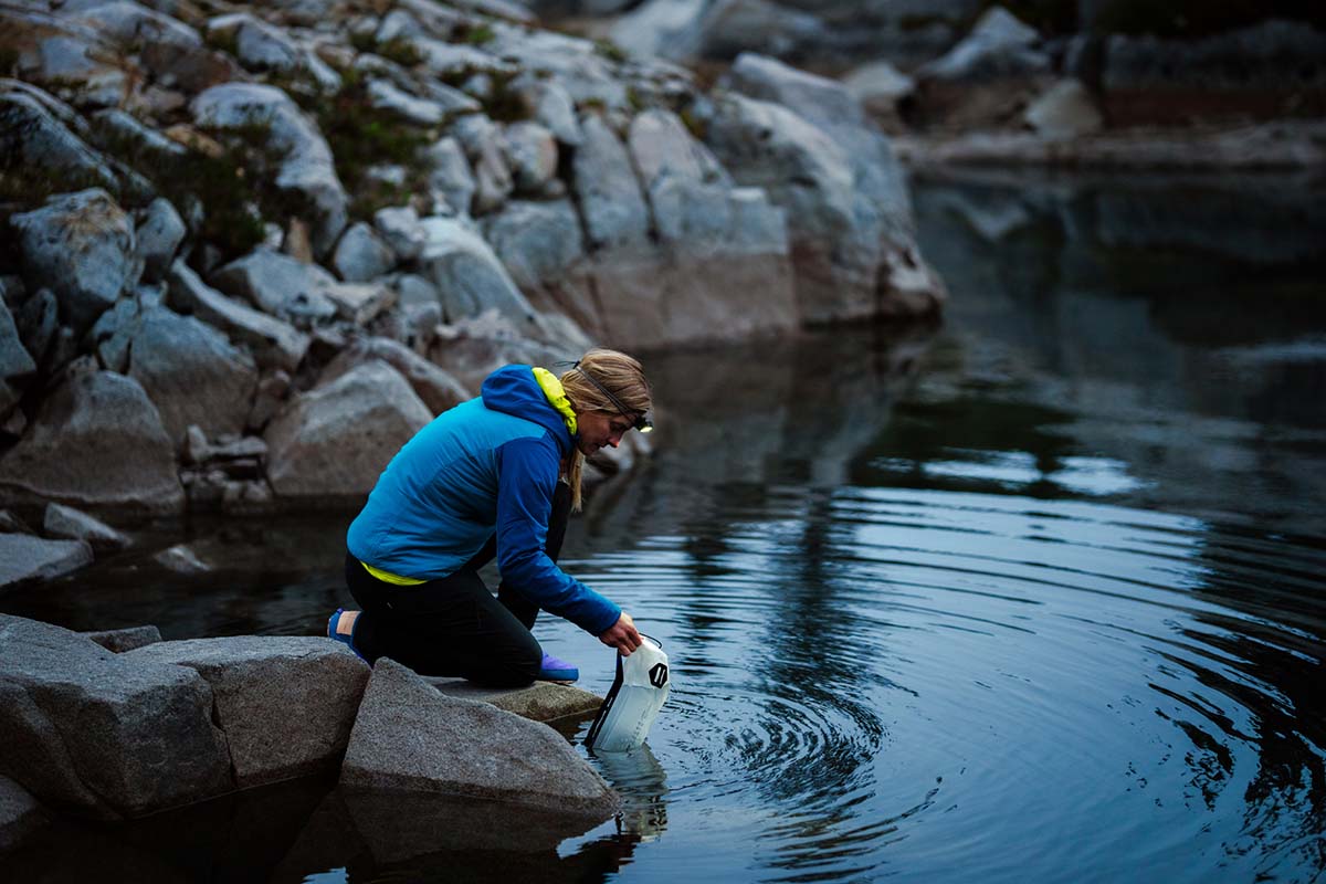 Patagonia Nano-Air Hoody (getting water from tarn)