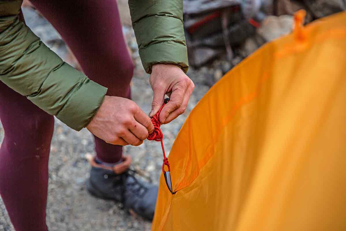 REI Co-op Trail Hut 2 Backpacking Tent (staking out the guy lines)