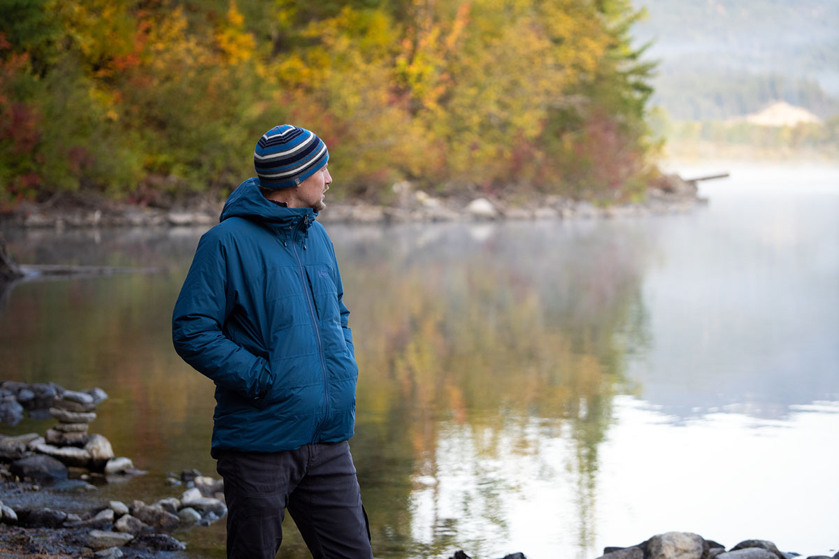 REI Co-op Stormhenge Down Hybrid Jacket (standing by lake with fall colors)