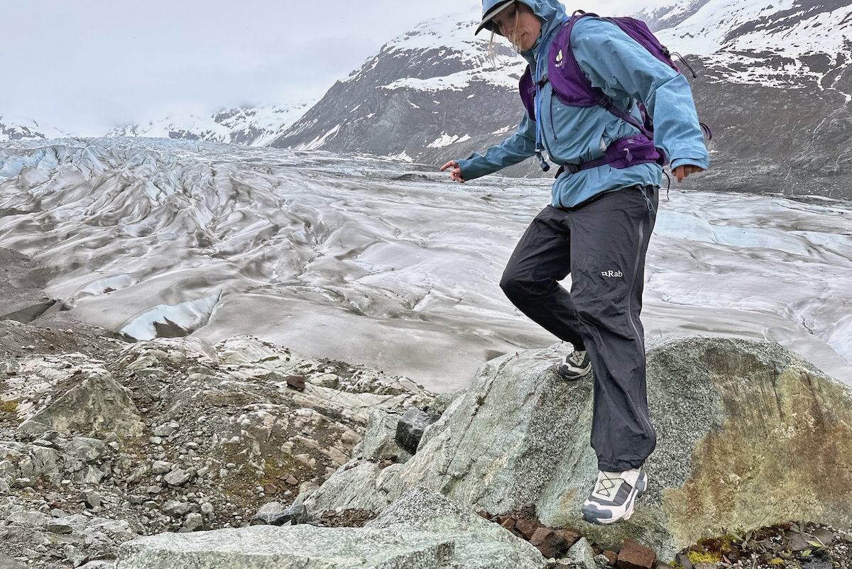 REI Co-op XeroCloud 3L stepping down from a rock 
