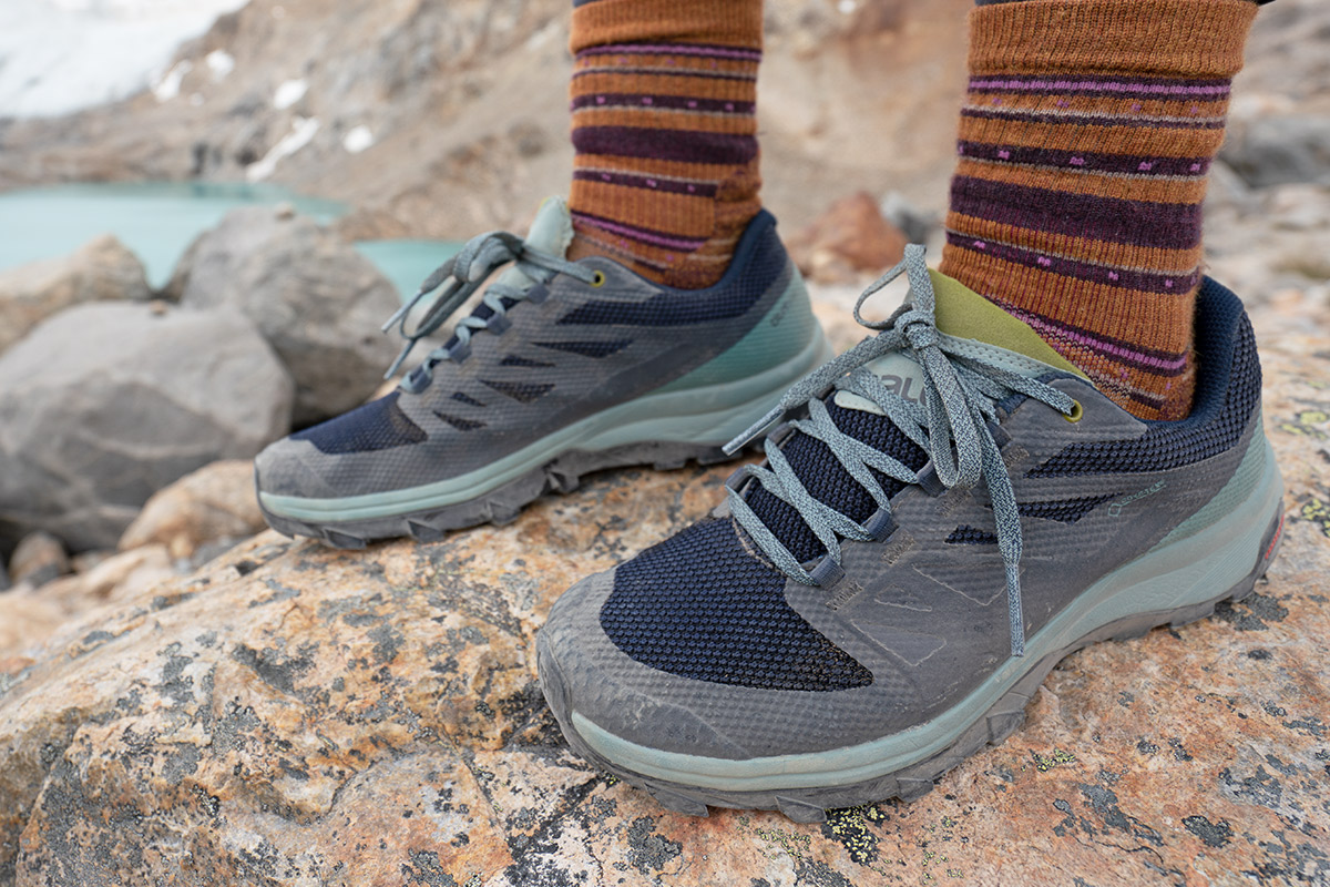 Salomon OUTline GTX (side view by lake in Patagonia)