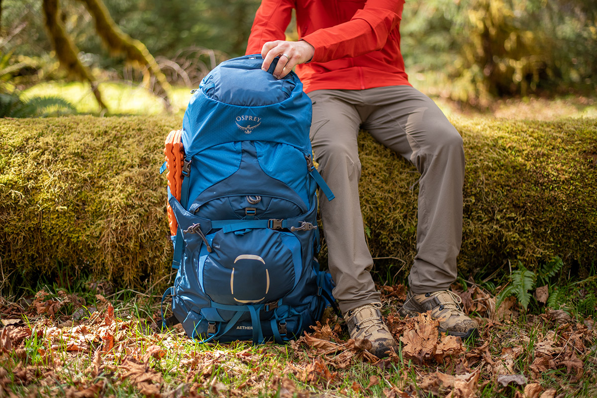 Salomon Quest 4 GTX hiking boot (sitting on mossy log)