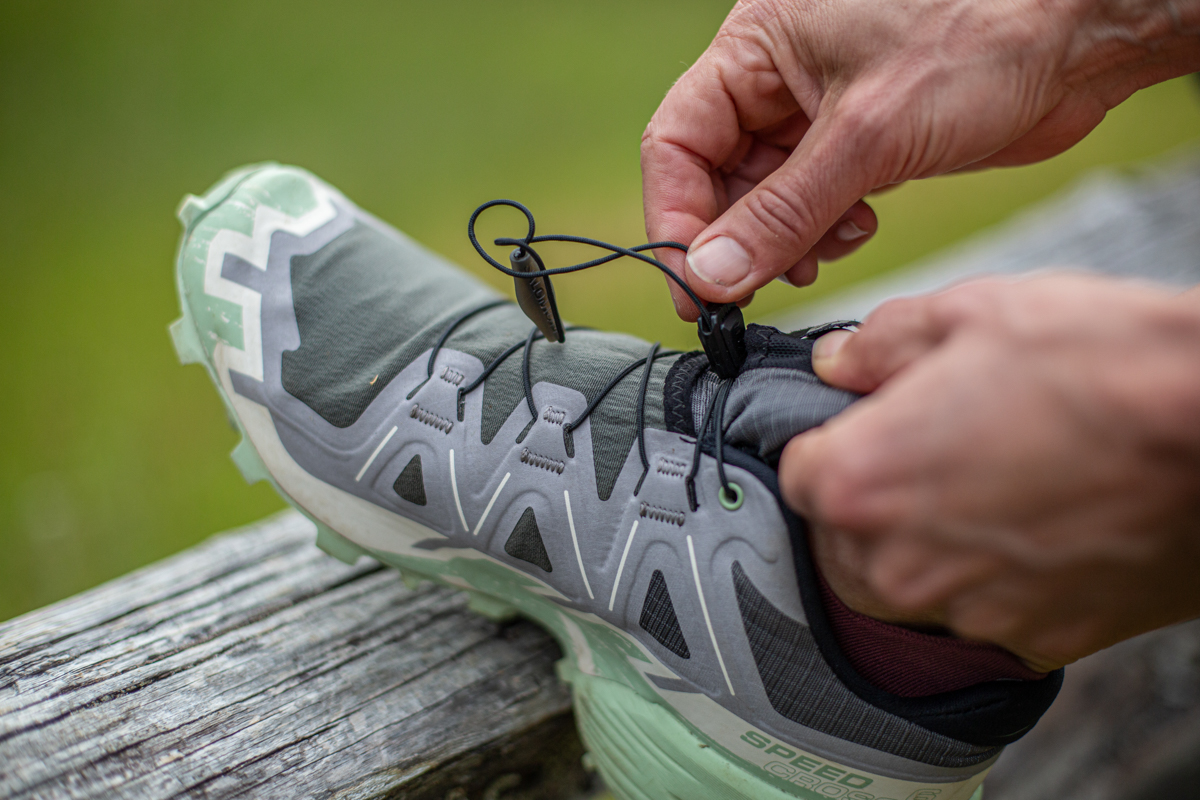 Close up of the Quicklace system on the Salomon Speedcross 6 trail running shoes