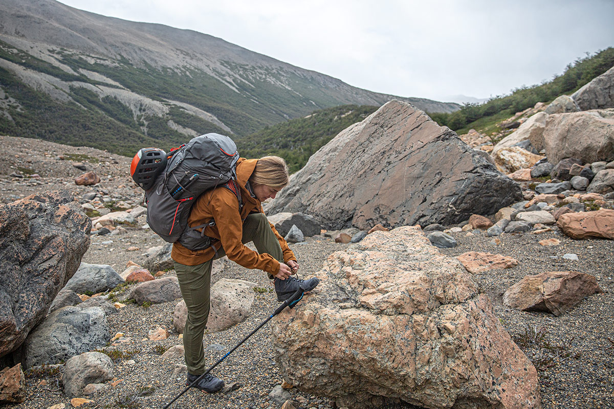 Salomon X Ultra 4 GTX Mid (tying shoe along gravel trail)