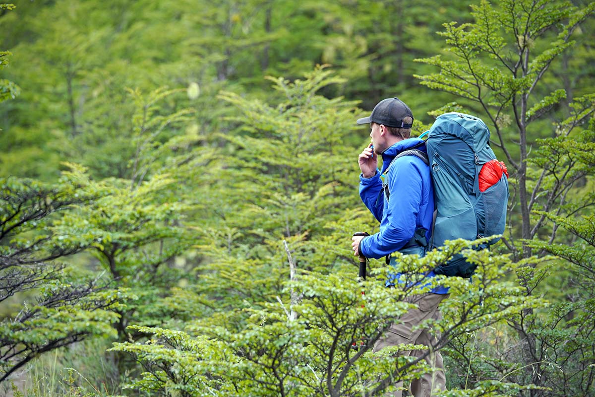 The North Face Ventrix Hoodie synthetic insulated jacket (in forest with pack on)