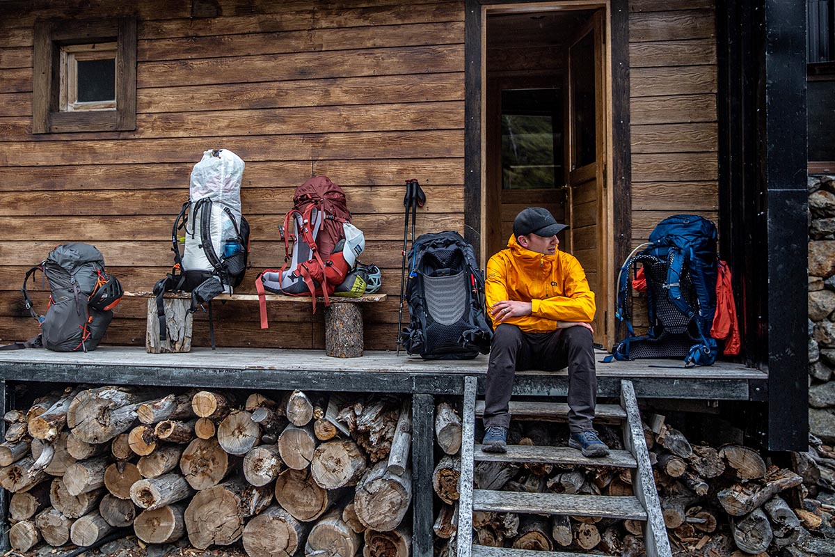 Topo Athletic Trailventure hiking boot (sitting in front of backcountry hut)