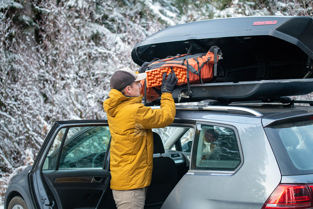 Yakima SkyBox 16 cargo box (unloading camping gear)