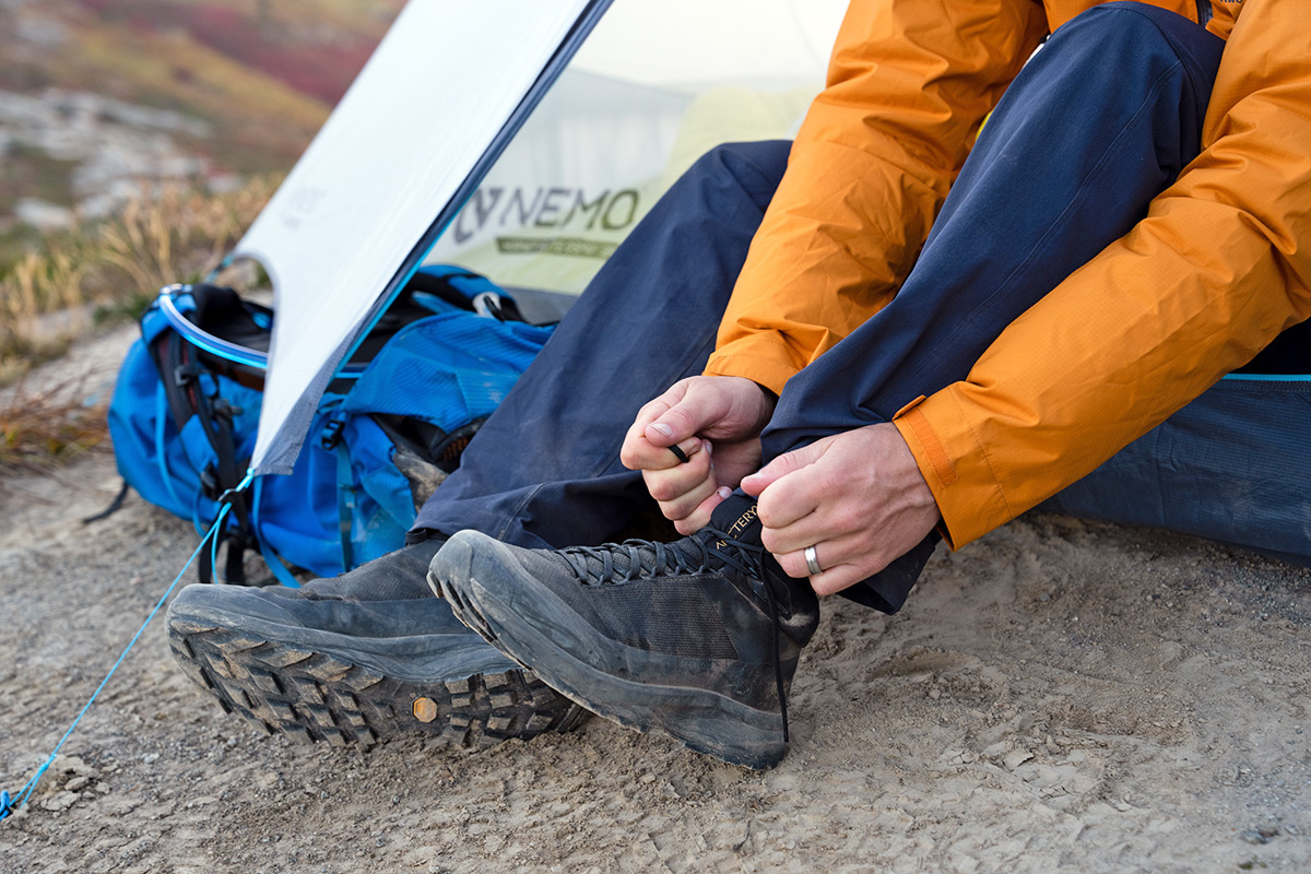 Best hiking footwear brands (tying laces on Arc'teryx Aerios FL 2 Mid)