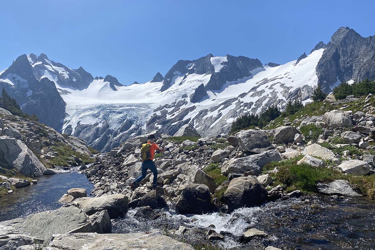 Hopping across a stream on the Ptarmigan Traverse