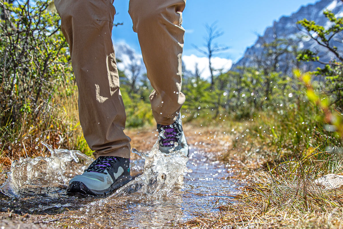 Salomon hiking footwear (splashing through puddle in Predict Hike Mid GTX)