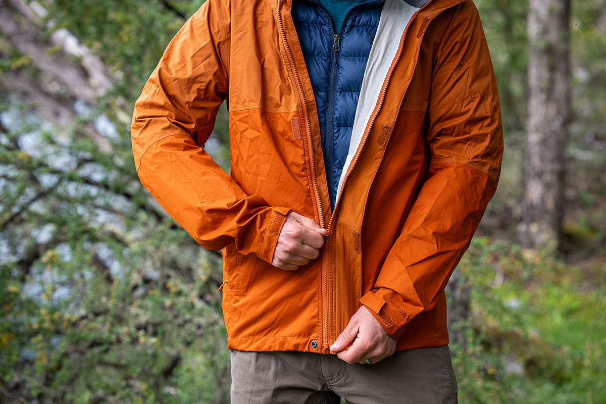 REI Anniversary Sale (zipping up REI Rainier Rain Jacket)