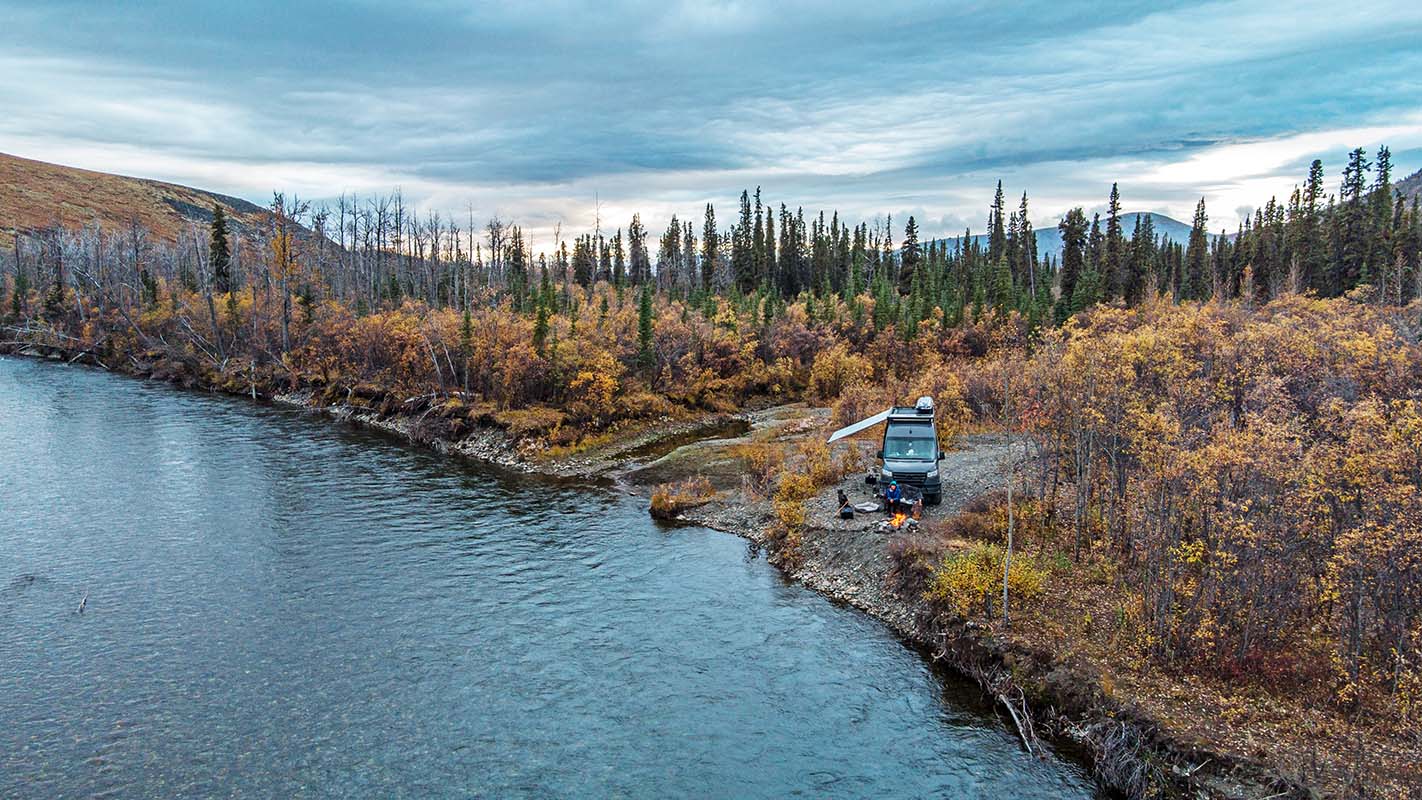 Van camping beside river along Dempster Highway