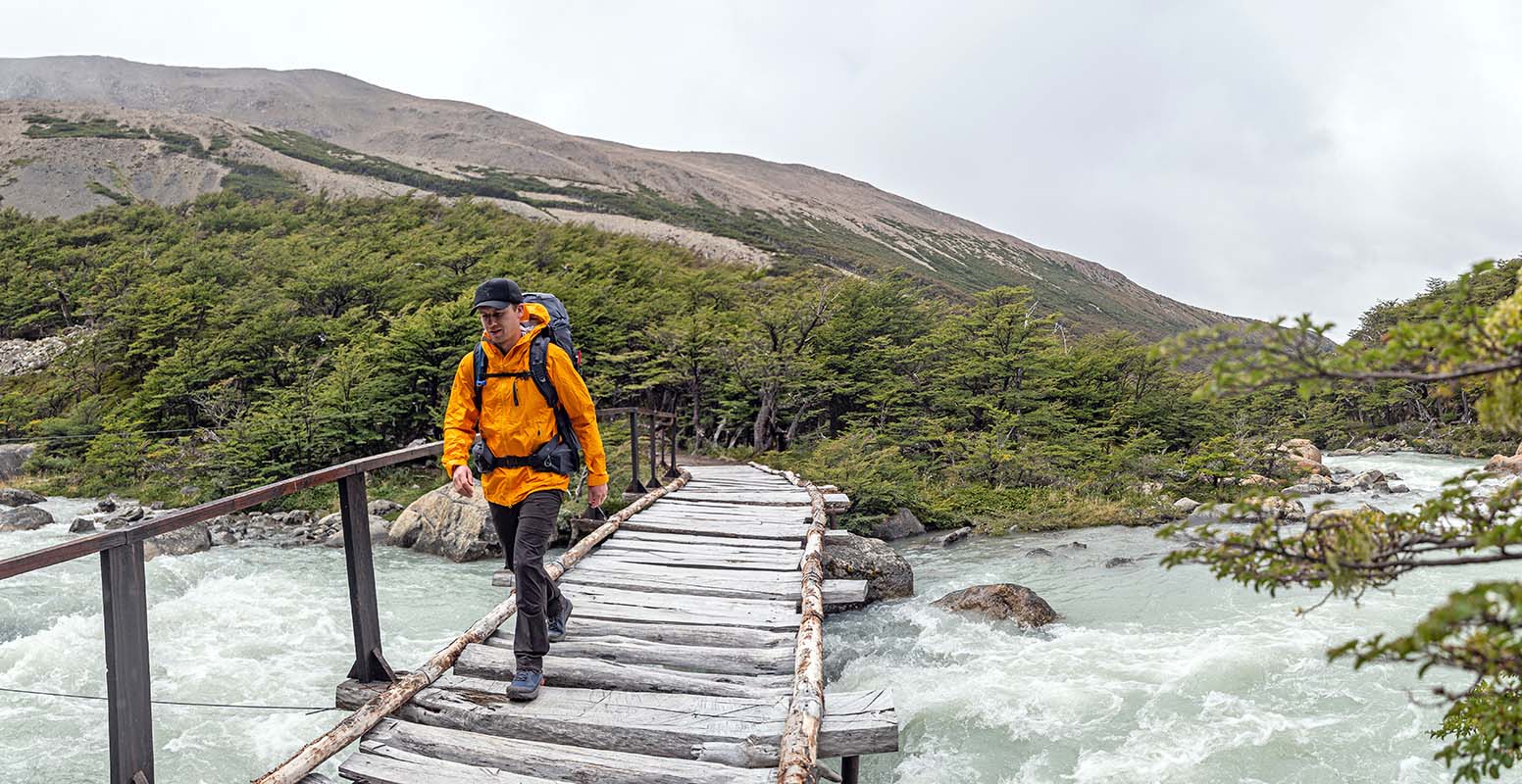 John hiking across bridge