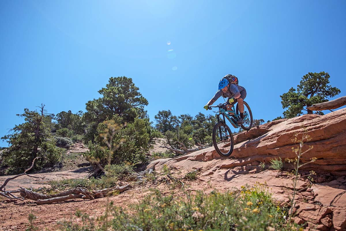 Biking downhill over red rock