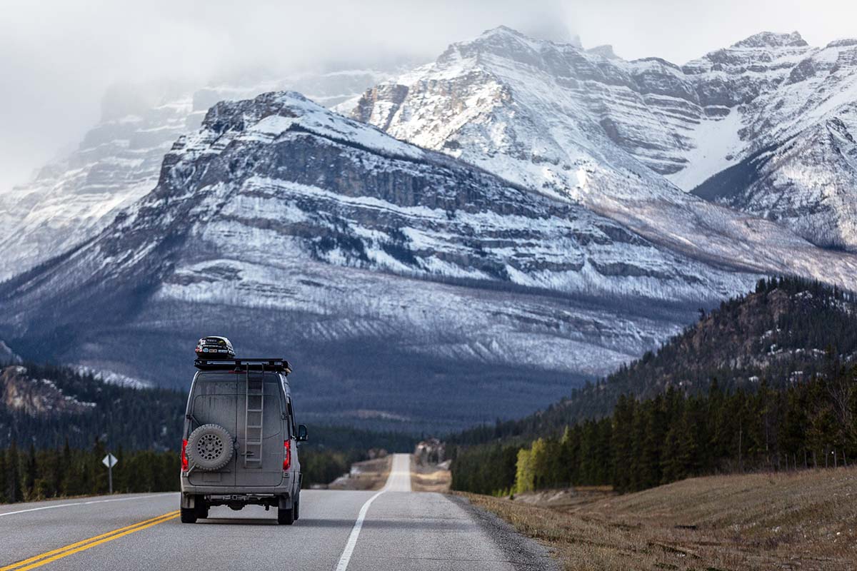 Sprinter van driving down road in Canadian Rockies