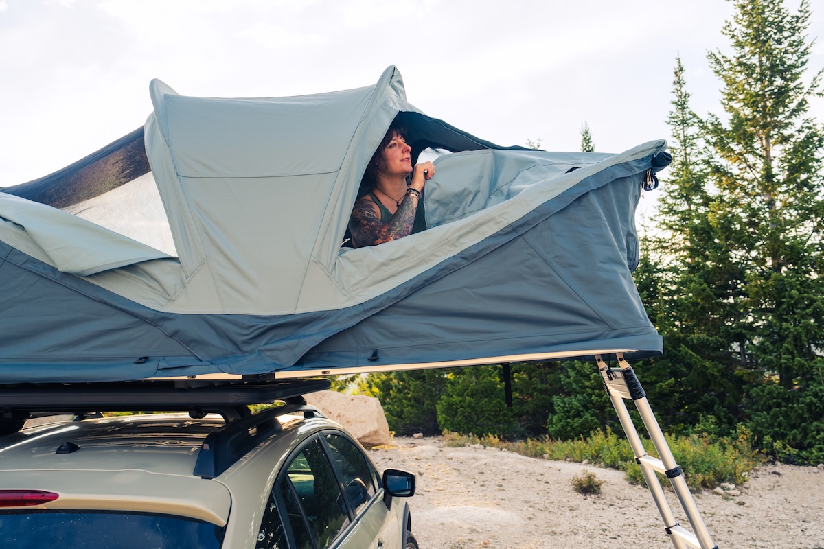Peaking out of a rooftop tent installed on the Yakima LockNLoad platform