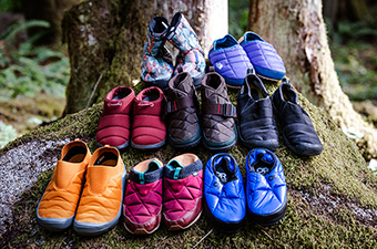 Camp shoes (grouped together on rock)