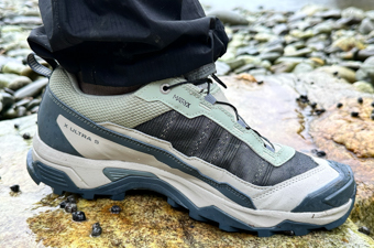 Close up of green and brown Salomon hiking shoe