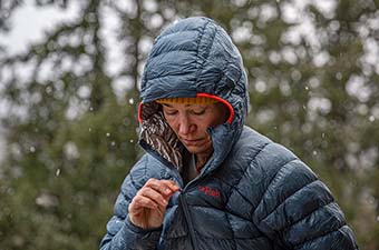 Down Fill and Insulation Explained (zipping up Rab Mythic G down jacket)