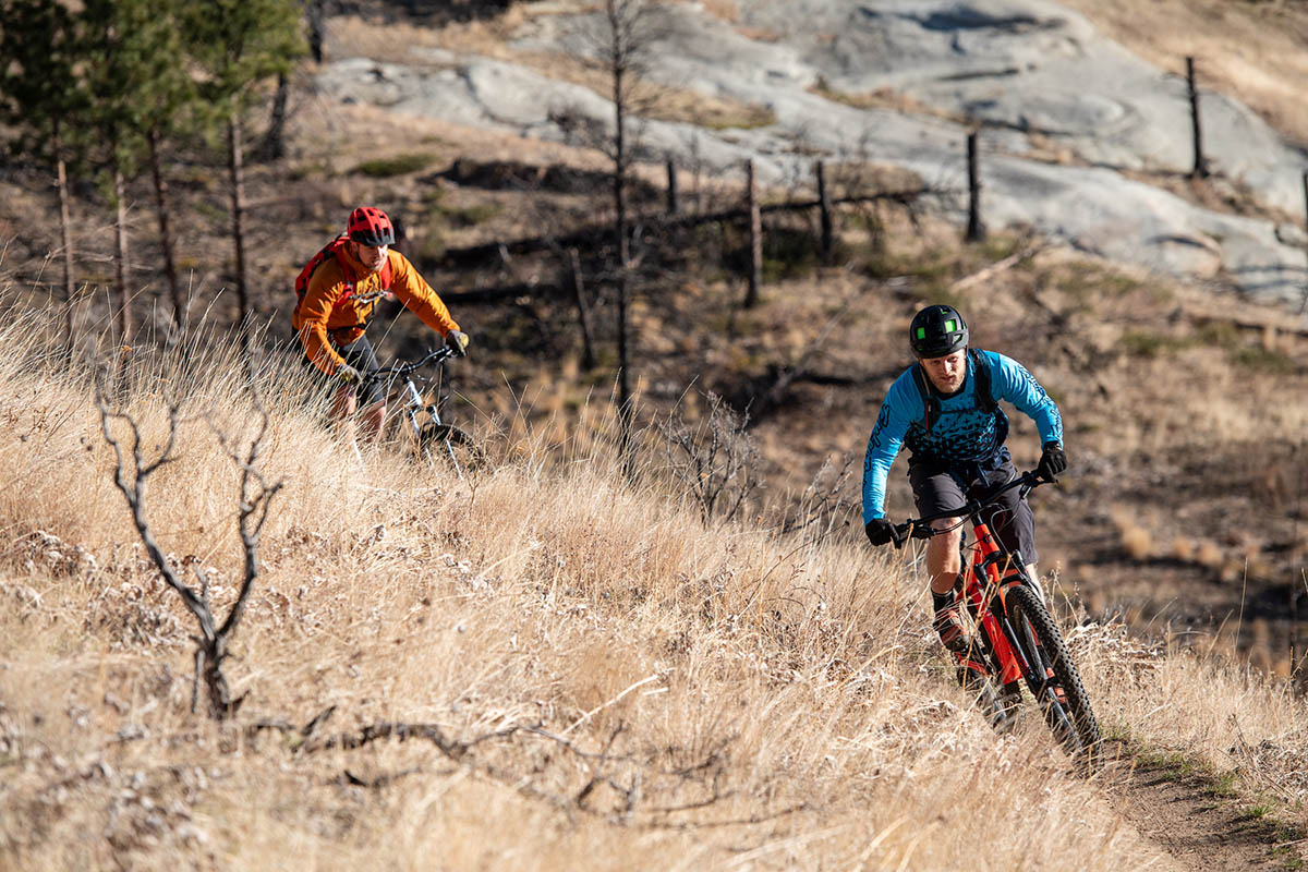 Mountain bikes (rounding corner on dirt trail)